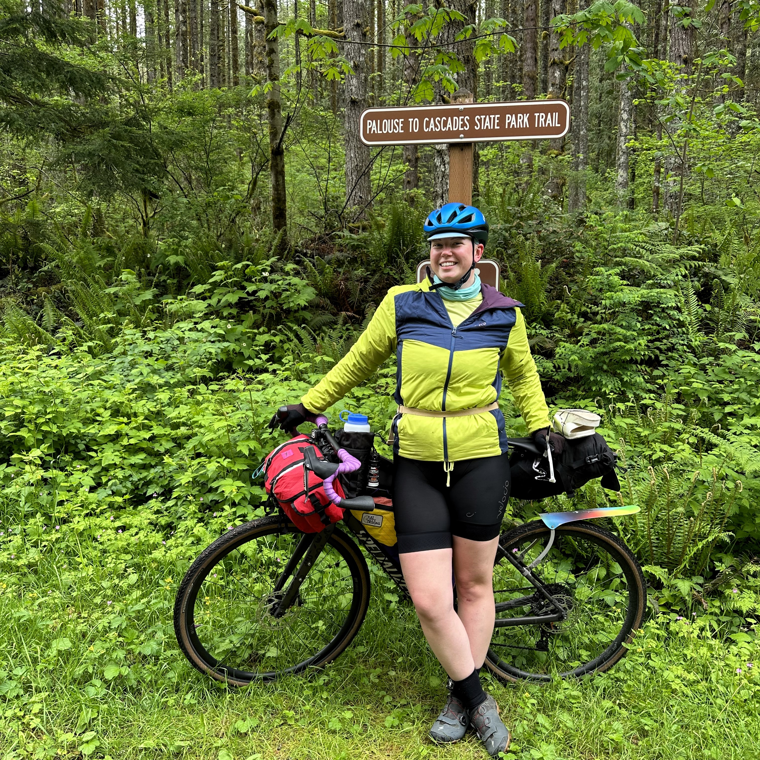posing by the Palouse to Cascades sign